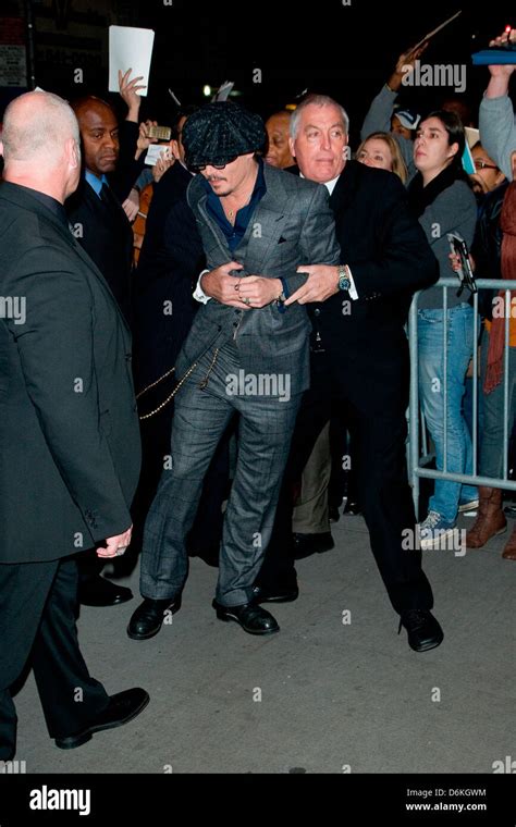 Johnny Depp Is Pulled Away By His Security Guard While Signing