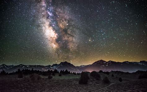 Download Wallpaper 1440x900 Galaxy Night Starry Sky Mountains