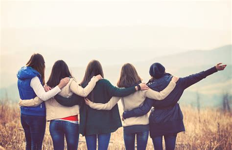 Group Of Friends Embracing Outdoors Stock Photo Download Image Now