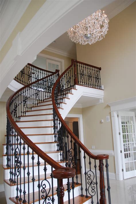 Wrought Iron Spindles Chair Rail Chandelier Curved Staircase Fluted Woodwork French Doors Iron ...