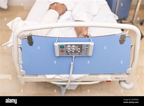 Patient Lying In Hospital Bed With Broken Leg Top View