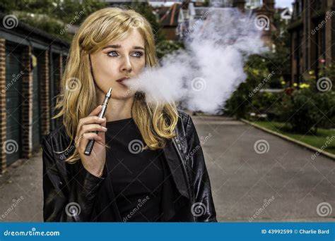 Pretty Woman Smoking An E Cigarette Stock Image Image Of Street