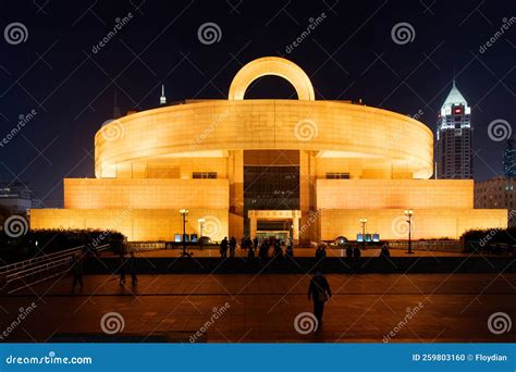 Shanghai Grand Theater Illuminated By Golden Landscape Lights Stock