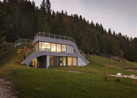 Grass Ramps Over The Curving Form Of This House In The French