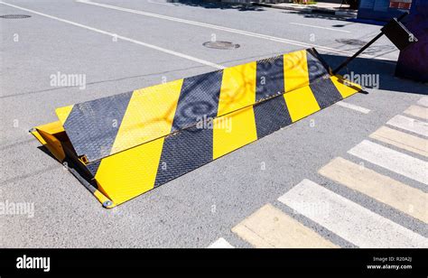 Yellow Black Striped Road Construction Stock Photos And Yellow Black