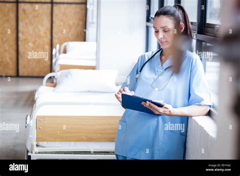Nurse Writing On A Clipboard Stock Photo Alamy
