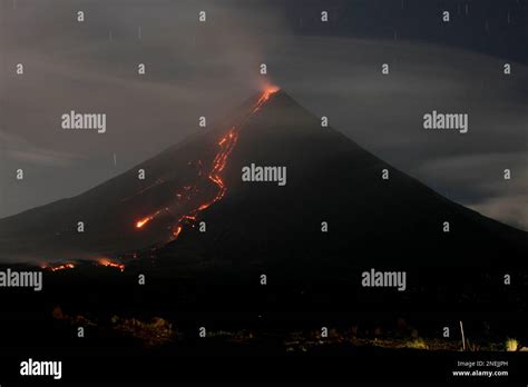 Lava Continues To Flow From The Crater Of The Restive Mayon Volcano In