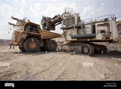 Fqm Mining Excavator And Large Hitachi Haul Truck Zambia Stock Photo