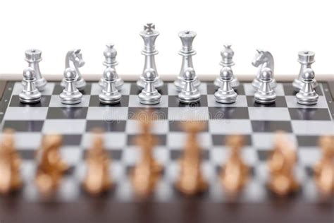 Silver Chess Pieces On A Chessboard Business Strategy Concept Stock