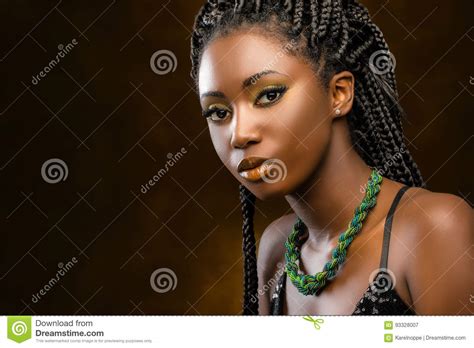 Studio Portrait Of Attractive African Woman With Braids Stock Image