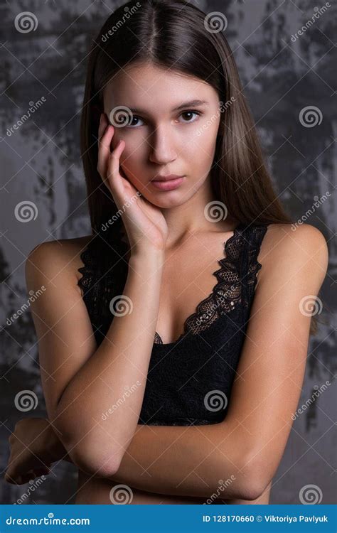 Test Shoot Of A Lovely Brunette Girl Posing In A Black Lace Bra Stock