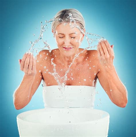 Splash Beauty Senior And Skincare For Woman In Studio For Grooming Skin And Hygiene On Blue