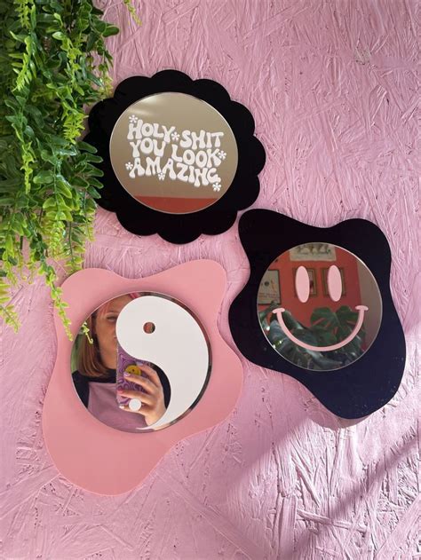Pink Wall With Collection Of Printed Weird Groovy Shaped Mirror Backs Available In Lots Of