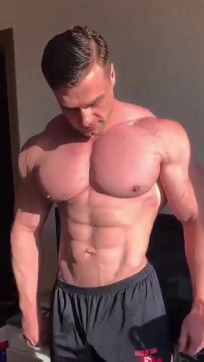 Man With Huge Hairy Muscles Posing And Flexing