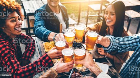 Group Of Multiracial Friends Having Bbq Dinner Party Together Diverse Young People Sitting At