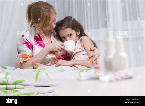 Mother Embraces The Sick Child Sore Throat Stock Photo Alamy