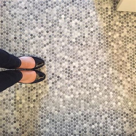 This pretty geometric floral doormat is made of brushed, knitted and coated polyester, so it totally waterproof and a snap to clean. 45 Trendy Penny Tiles Ideas For Bathrooms - DigsDigs