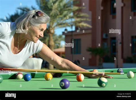 Mature Woman Playing Pool Stock Photo Alamy