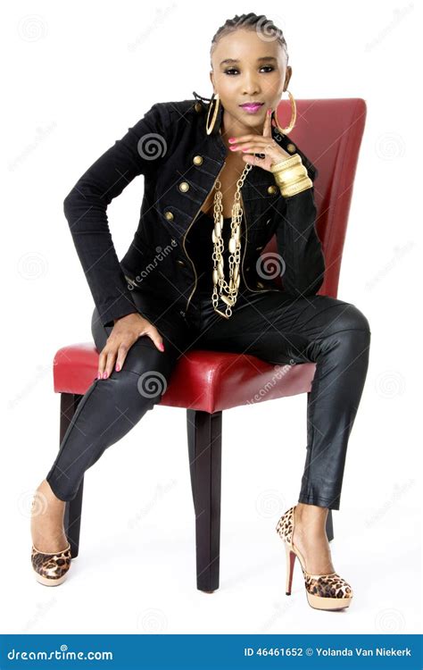 Young Beautiful African Woman Sitting On Red Chair Stock Photo Image