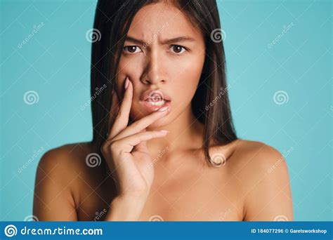 Close Up Serious Asian Brunette Girl Angrily Looking In Camera Over Colorful Background Isolated