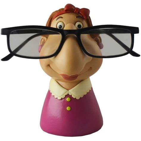 A Close Up Of A Figurine With Glasses On Its Head And Nose