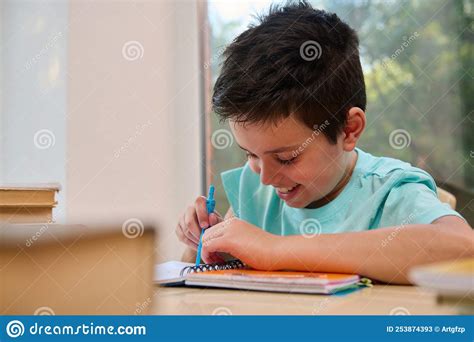 Close Up Schoolboy Draws A Circle With Drawing Compass While Doing