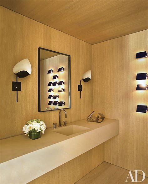An Aspen Colorado Powder Room By Atelier Am Is Lit By A Pair Of