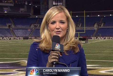 a woman holding a microphone in front of a football field with the nfl logo on it