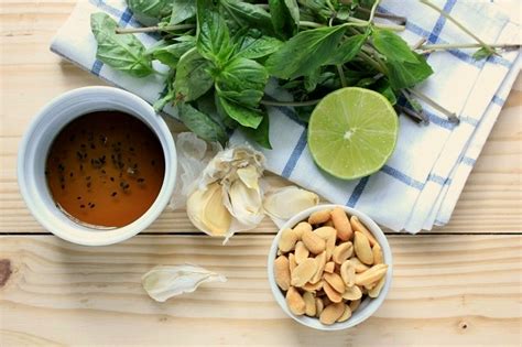 Combine walnuts, garlic, basil leaves, spinach, olive oil, lemon juice, nutritional yeast, and salt in a blender or food processor. Roasted Veg. & Tofu-Stuffed Sweet Potatoes with Thai Pesto