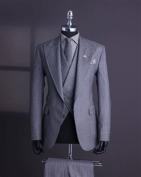a light grey ivory pencil stripe jorgecarli knitted peak lapel suit v shaped double
