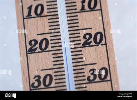 Wooden Thermometer In Snow With Freezing Temperature Stock Photo Alamy