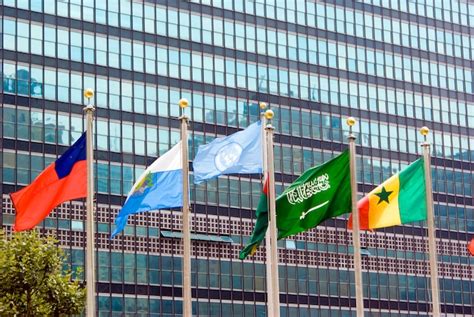Premium Photo Flag Of The Un And Other Countries Waving In Front Of