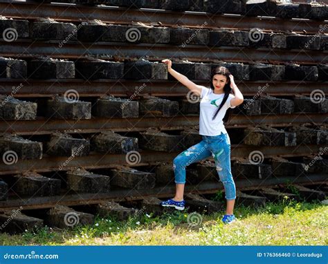 Portrait Of A Beautiful Brunette That Stands Near The Railway Tracks Stock Photo Image Of