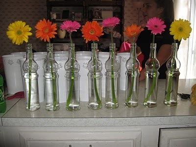 Clear Bottles With Gerbera Daisys Wedding Centerpieces Diy Daisy