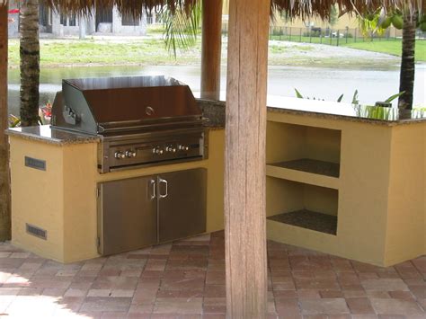 Family having barbecue together on backyard on summer day. Backyard Barbecue Ideas | Lynx built in bbq grill in ...
