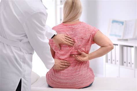 Chiropractor Examining Patient With Back Pain Stock Image Image Of