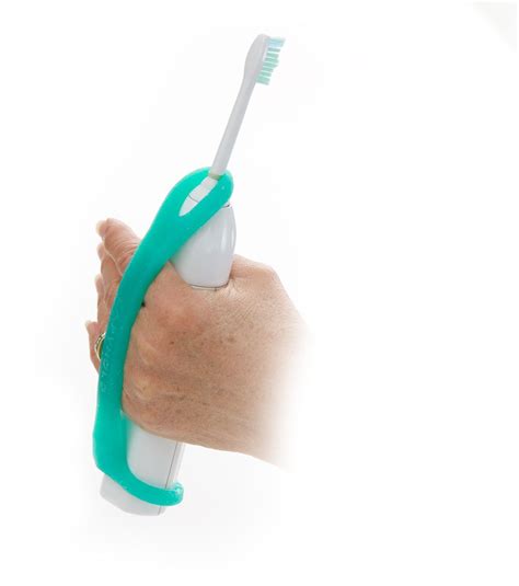 Eazyhold In Use With A Toothbrush A Revolutionary New Strap That Can