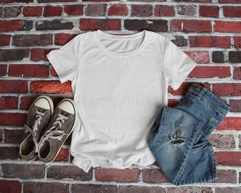 mockup flat lay  white tee shirt  gray canvas shoes  ripped jeans   aff white
