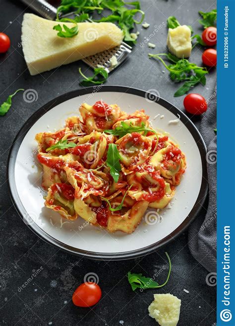Spinach Ricotta Ravioli In Tomato Sauce With Wild Rocket And Parmesan Cheese Stock Photo Image