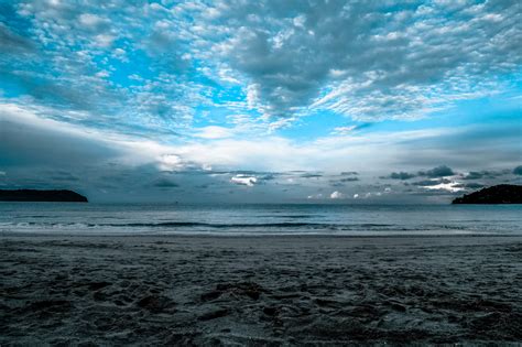 Free Photo Gray Sand On Sea Shore Under Cloudy Sky During Daytime