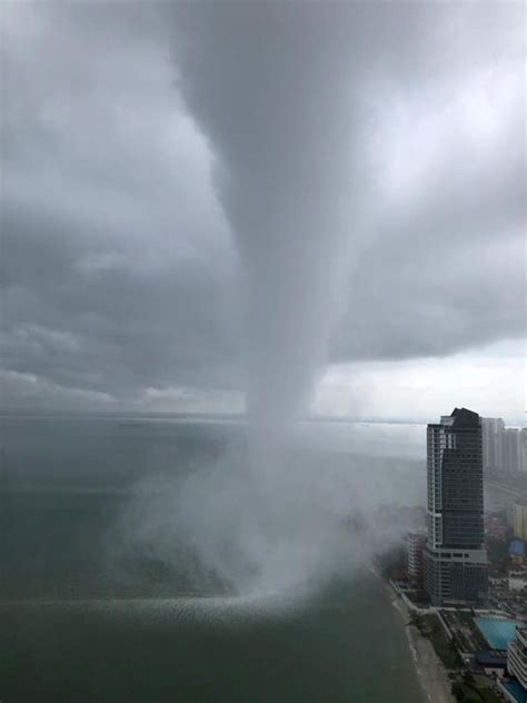 Apocalyptic Water Tornado Speeds Towards City Leaving Buildings In