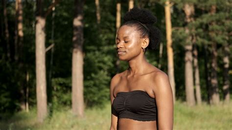 Calm Young Black Woman Taking A Deep Breath Of Fresh Air Relaxing