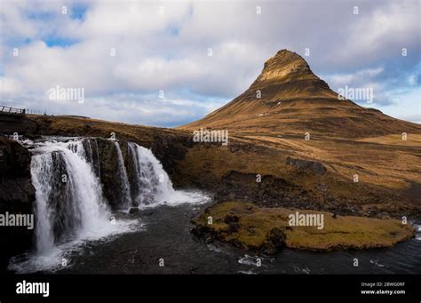 The Kirkjufell Mountain And The Kirkjufellfoss Waterfall At