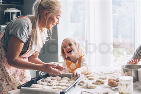 Mom Cooking With Daughter On The Kitchen Stock Image Colourbox