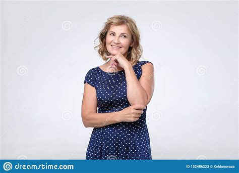 caucasian mature woman in blue dress smiling stock image image of beautiful casual 152486223