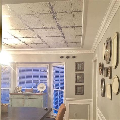 I absolutely love how the faux tin tile ceiling looks in the office. Faux tin tile ceiling using peel and stick temporary ...