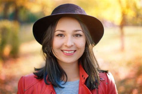 Autumn Portrait Of A Girl Woman In A Hat And Red Jacket Stock Image