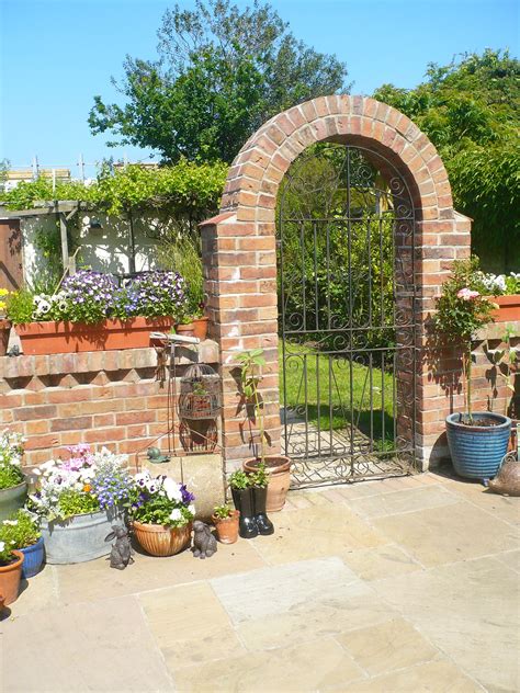 Brick Arch Metal Garden Gate In Our Garden Garden Archway Brick Wall