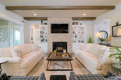 Neutral Transitional Living Room With Stone Fireplace Surround Hgtv