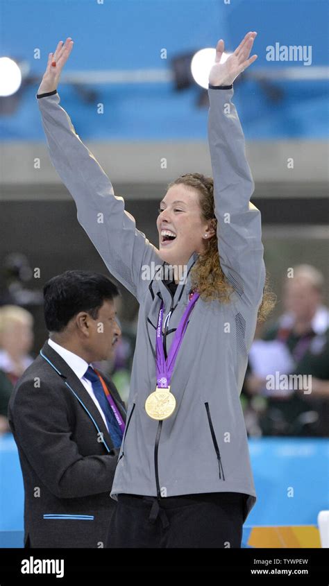allison schmitt of the united states waves after winning the gold medal in the women s 200m